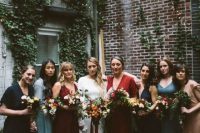 bright mismatched boho bridesmaids’ dresses in blue, navy, red, burgundy and light blue