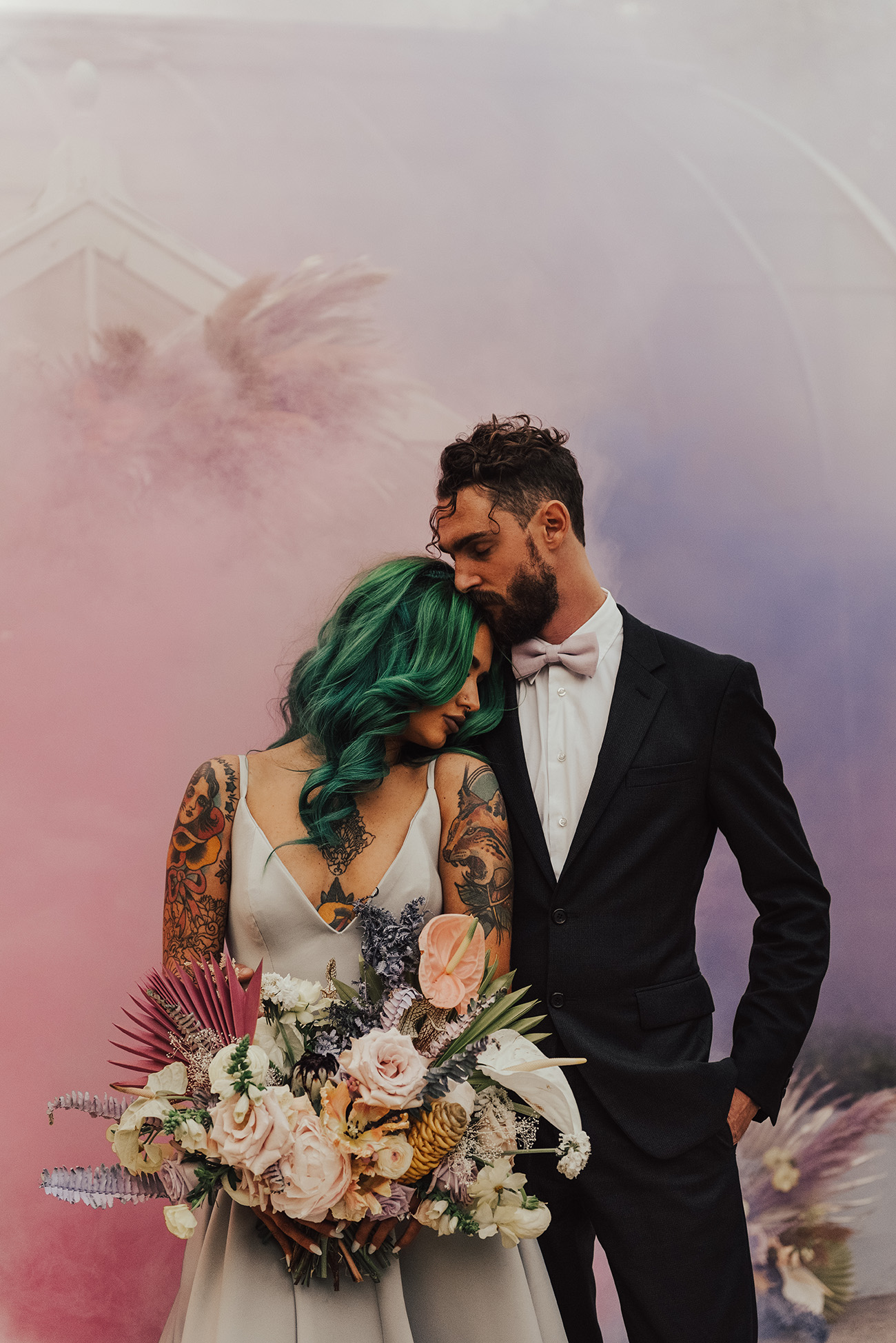 bring a romantic pastel feel to the wedding portraits with blush and lavender smoke in the pic