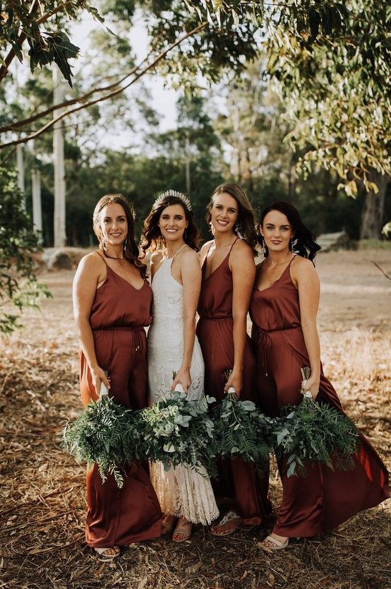 burgundy slip maxi bridesmaid dresses with deep necklines are a bold idea for a fall wedding
