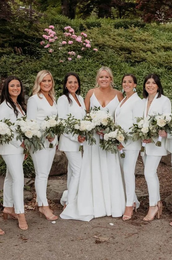 classic white pantsuits with white tops underneath, nude shoes are a perfect solution for a modern bridal party in white