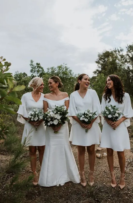 Comfy and lovely white over the knee A line bridesmaid dresses with bell sleves and V necklines are cool for a neutral wedding