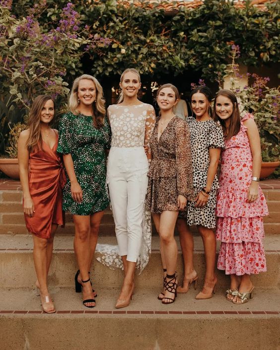 mini and midi mismatching bridesmaid dresses with various prints are amazing for a bold boho wedding