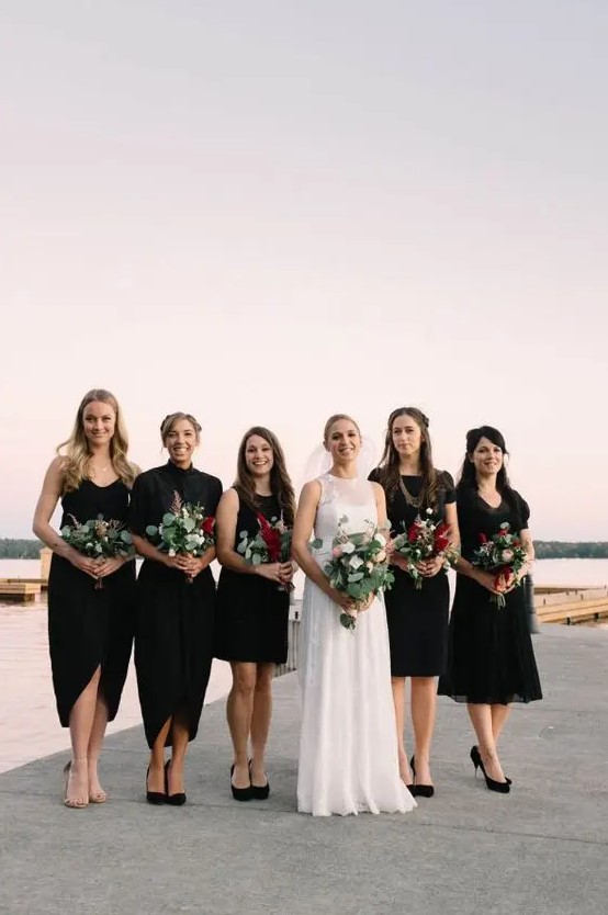 mismatching black bridesmaids' dresses with various necklines, lengths and different shoes