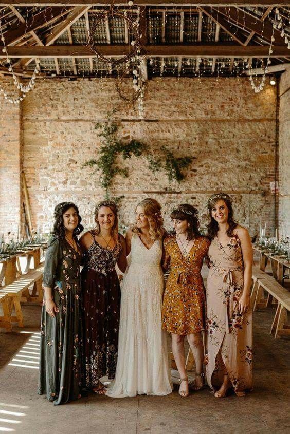 mismatching maxi and knee bridesmaid dresses with floral prints are a great solution for a boho wedding