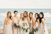 mismatching neutral beach bridesmaid dresses in cream and blush, with various designs and necklines