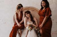 mismatching terracotta bridesmaid dresses with various necklines and looks are great for a boho wedding