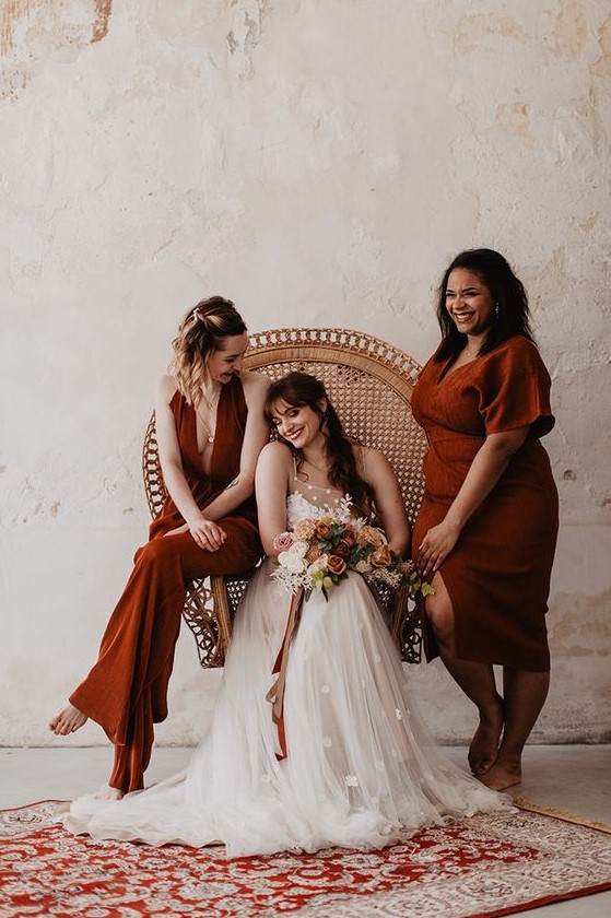 mismatching terracotta bridesmaid dresses with various necklines and looks are great for a boho wedding