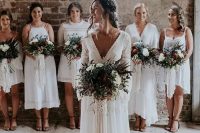 mismatching white boho bridesmaid dresses of mini and midi length with boho lace look very cool and stylish