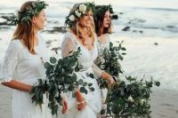 mismatching white lace dresses with a boho feel and greenery crowns for a fresh look