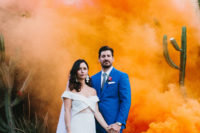 orange smoke creates an impression of a sunrise in the desert and adds color to the photo