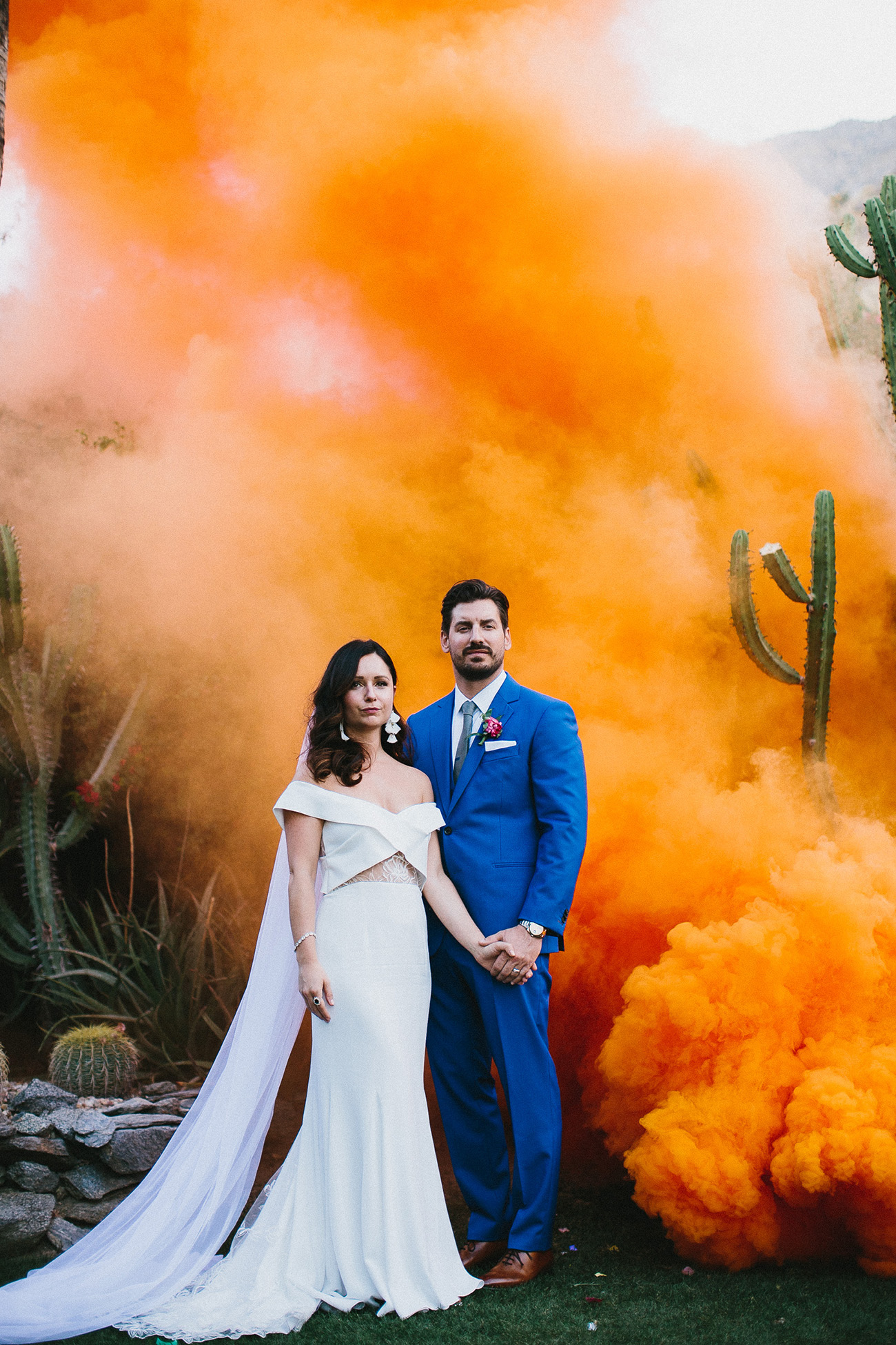 orange smoke creates an impression of a sunrise in the desert and adds color to the photo