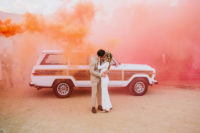 set the world on fire with orange and pink smoke as a backdrop for your wedding pic