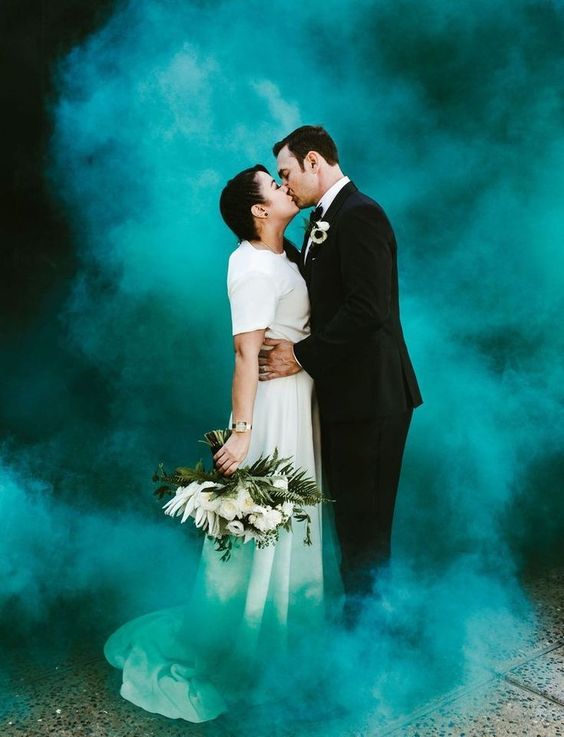 stand in a colorful smoke cloud and kiss   you won't need a better backdrop for that