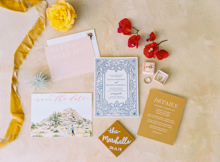 The wedding invitation suite was done in mustard, blues and blush, with pics of your wedding