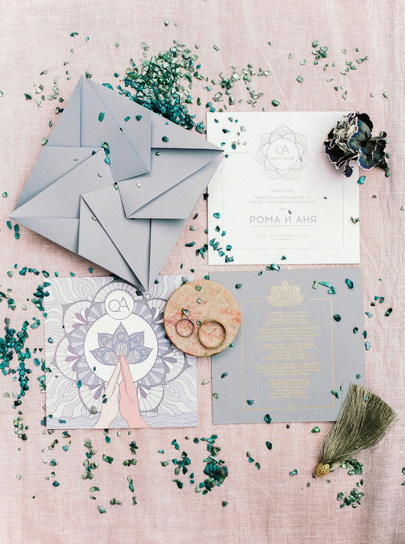 The wedding stationery was done in light greys, gold and white and with geometric envelopes