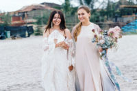 03 The bride was wearing a Rue De Seine wedding dress with a halter neckline, bell sleeves and tassel earrings