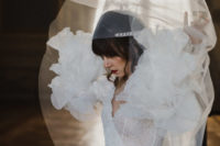 03 The bride was wearing a sparkling sheath wedding dress with an embellished sash and whimsy ruffled sleeves
