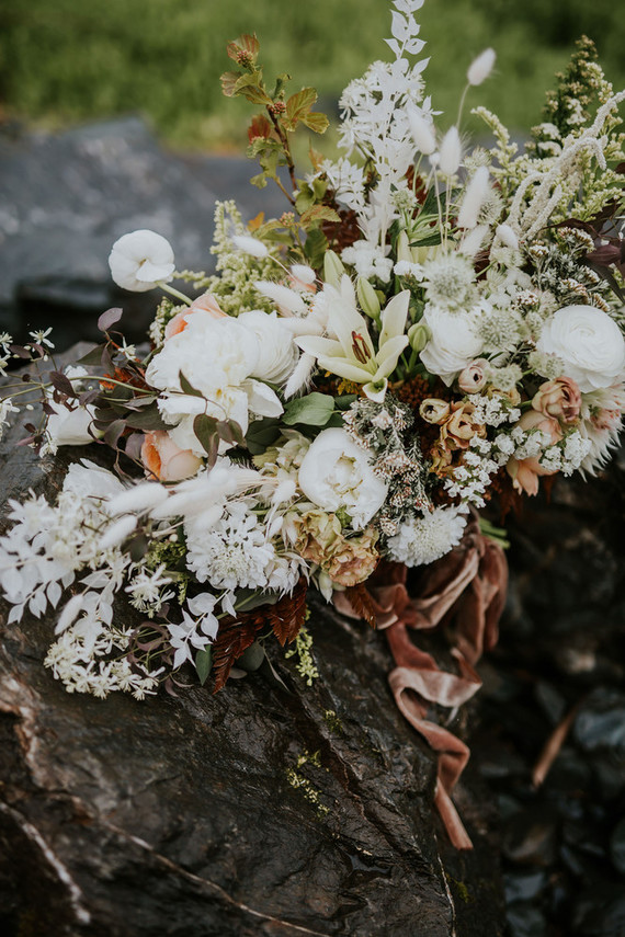 The wedding bouquet was neutral and all-textural, with foliage and herbs of various kinds