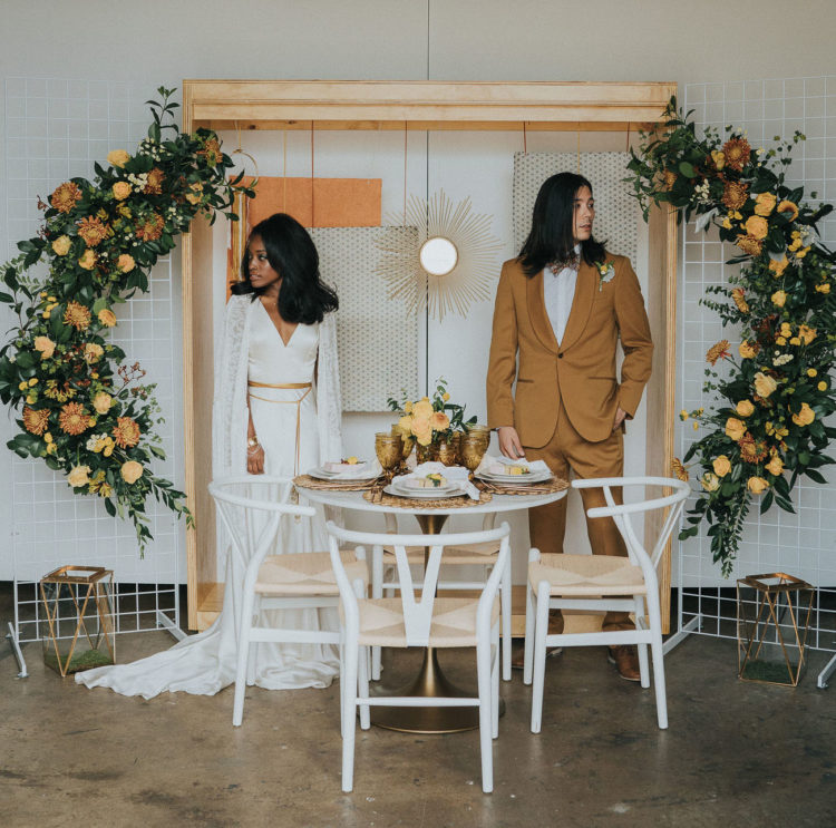The reception space was done with rust and mustard blooms plus greenery