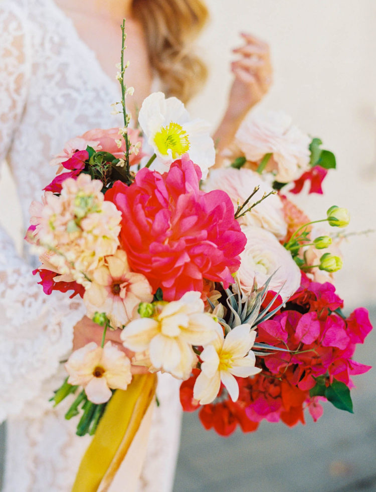 The wedding bouquet was done with fuchsia, blush and neutral blooms and air plants