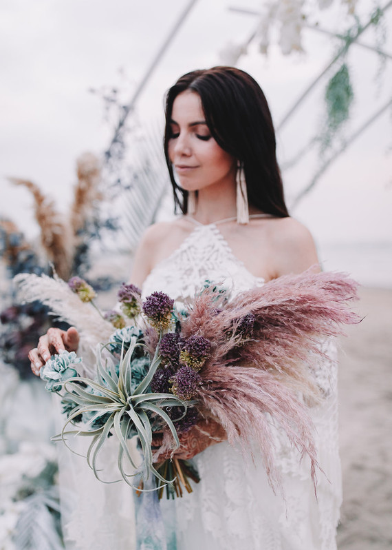 Her bouquet was done with ai plants, dried blooms and herbs
