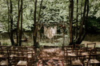 06 One wedding arch was made of branches, greenery and macrame and there were Persian rugs and candles around