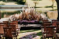 06 The ceremony space was done with pampas grass, pink blooms, greenery and with pink petals