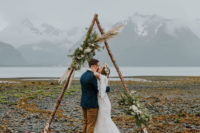 a wedding arch is shaped like a triangle and made of wood