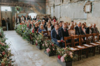 06 The wedding aisle was lined up with lush florals and lots of greenery