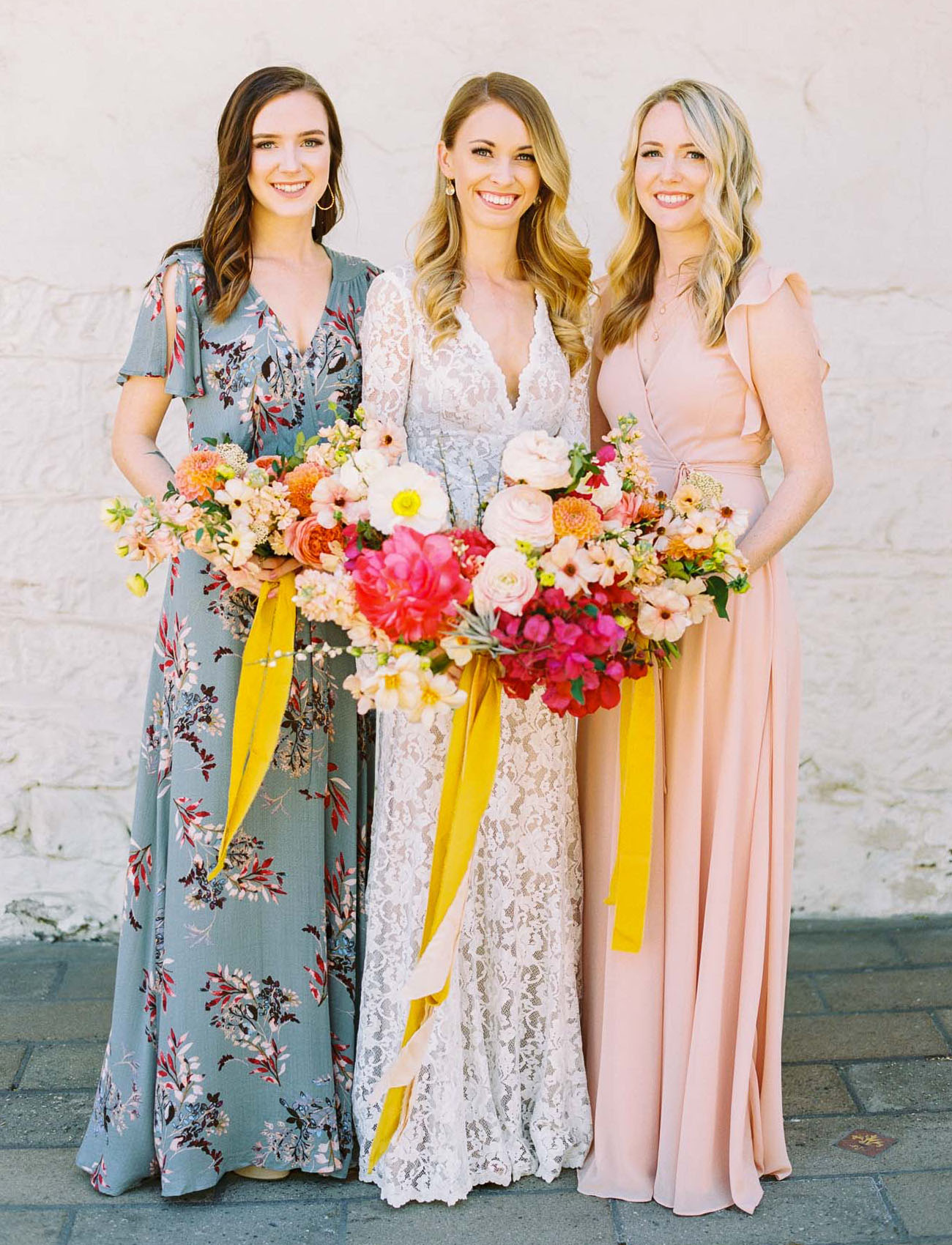 The bridesmaids were wearing mismatching maxi wrap dresses