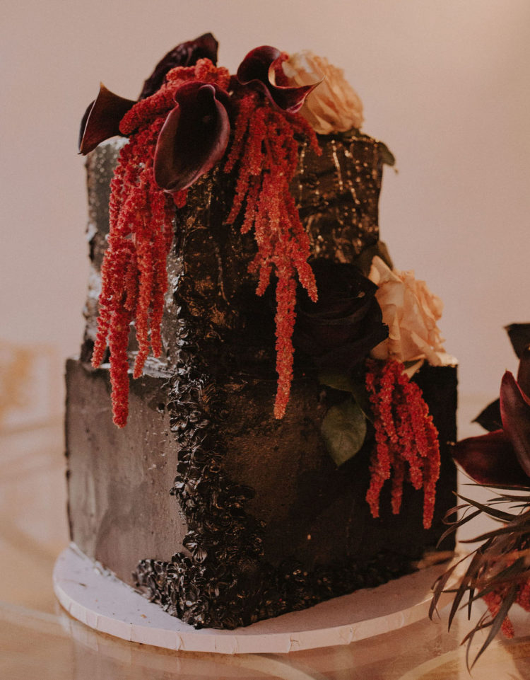 The wedding cake was a textural black one, with dark and red and orange blooms plus dried foliage