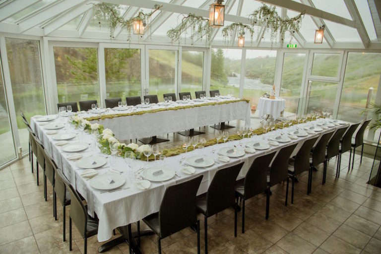 The wedding reception was in a glass house to enjoy the vies, and the decor was minimal - just some greenery over the table