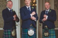 09 the groom and groomsmen wearing navy blazers and ties and plaid kilts plus traditional shoes and socks
