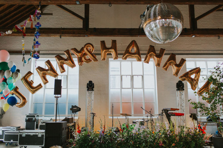 Lush florals were everywhere, and colorful balloons added a party feel to the reception