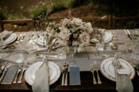 table decorated with floral centerpieces