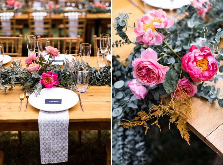 The table runners were done with greenery and pink blooms, and gold rim glasses added elegance