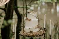 12 The wedding cake was a white one, topped with twigs, berries and a bit of blooms