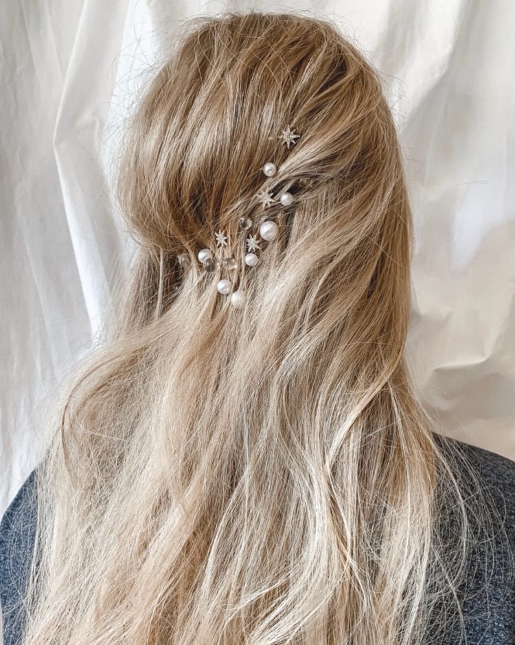 messy hair with a texture and some pearl, star and sheer hair pins are amazing for a celestial bride