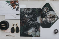 02 The wedding invitation suite was done with moody florals and white calligraphy