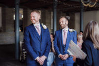 03 The grooms were wearing three-piece bold blue wedding suits and pink ties, all of them were custom-made for the couple