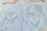 03 a beautiful light blue sleeveless wedidng dress with embroidery and beading on the bodice, an illusion neckline and a layered skirt