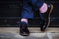 04 The groom’s style was quirky and fun – with bright blue laces and pink socks