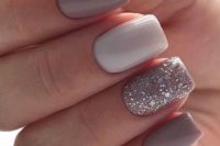 05 a grey and white wedding manicure and a shiny glitter accent nail for a stylish neutral look