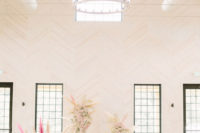 07 The wedding ceremony space was done with pink and blush blooms, some dried herbs, neutral blooms and greenery