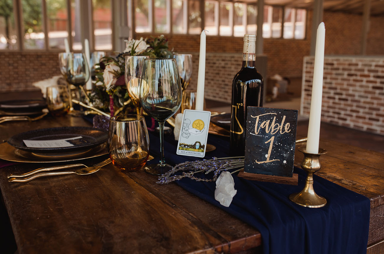 The wedding table was styled with a navy runner, candles, Taro cards, crystals and lavender