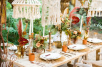 08 Candles, dried herbs and blooms, pampas and terracotta cups create a boho feel at the table