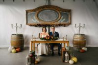08 Colorful pumpkins, candle lanterns, candleholders and a chalkboard added a cozy rustic fall feel to the space
