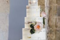 08 The wedding cake was naked, with gold leaf decor and pink blooms and foliage for a cozy feel