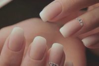 08 an ombre French manicure with shiny rhinestones on ring fingers is a frehs take on the traditional bridal choice