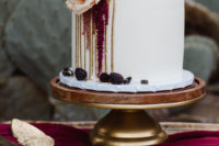 09 The wedding cake was a white one, with gold drip, blackberries, blush and red blooms
